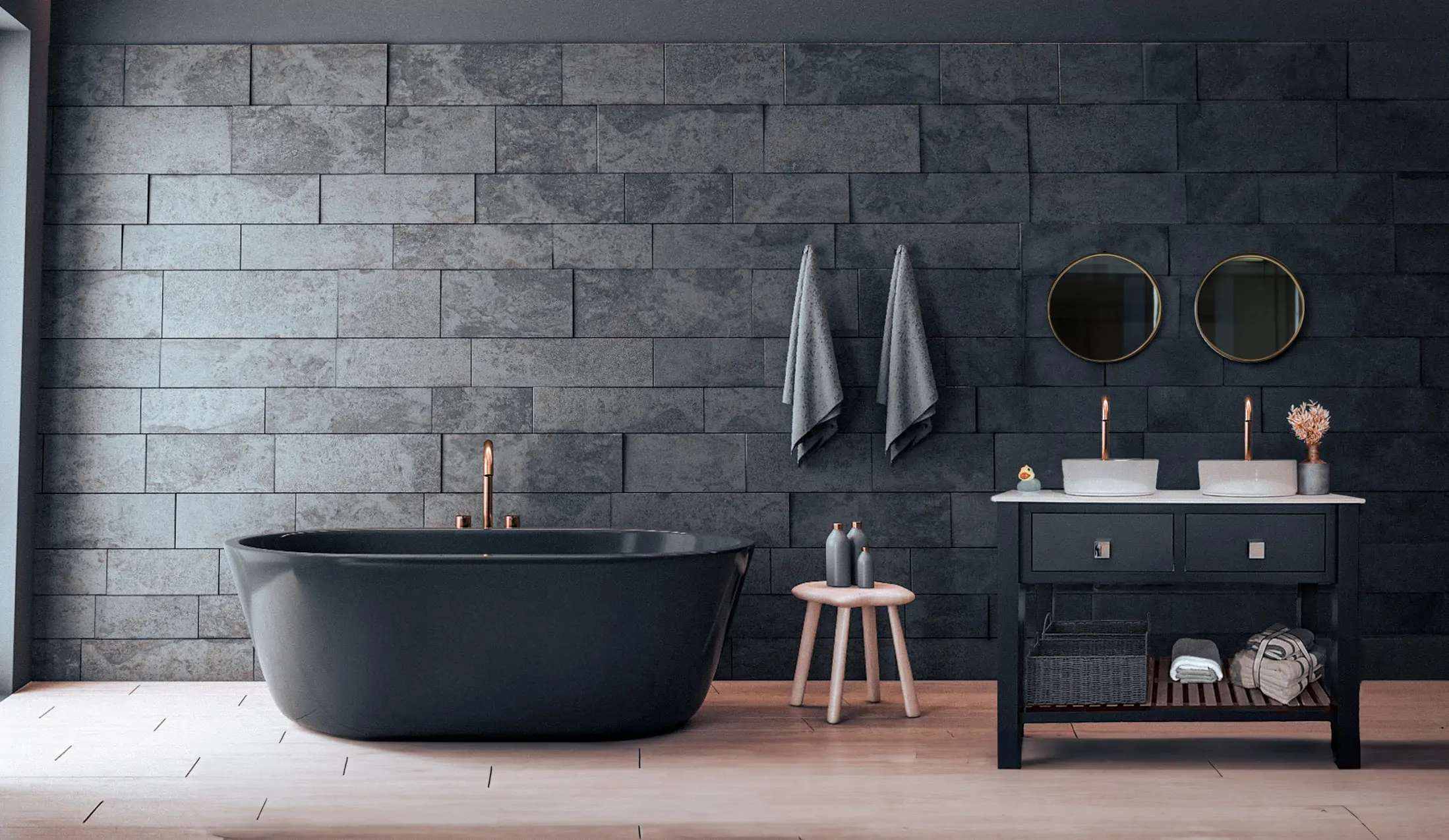 A charcoal bathroom vanity a grey stone bathroom with a dark grey bath
