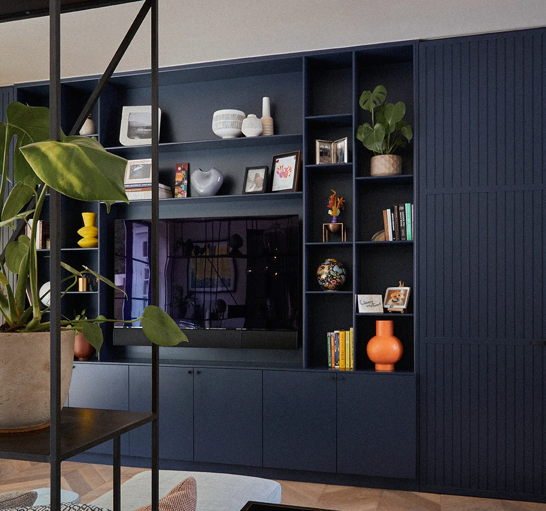 A large blue media wall, with shelving inside a large living area